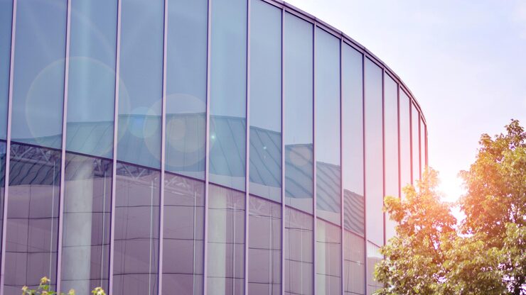 Building with glass facade tree background 991208 5999